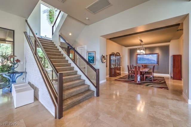583 Saint Croix St, Henderson, NV 89012 - staircase featuring a chandelier and a high ceiling