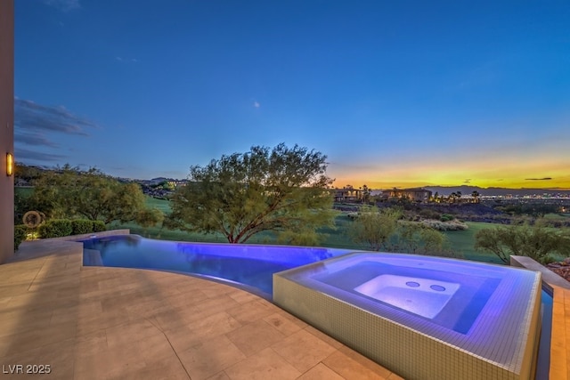 583 Saint Croix St, Henderson, NV 89012 - view of swimming pool featuring an in-ground hot tub, a patio, and an infinity pool