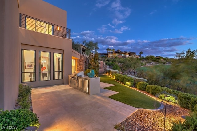 583 Saint Croix St, Henderson, NV 89012 - view of green lawn featuring exterior kitchen and a patio