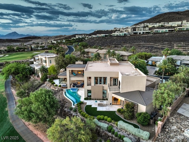 583 Saint Croix St, Henderson, NV 89012 - aerial perspective of suburban area with a mountainous background and a pool area