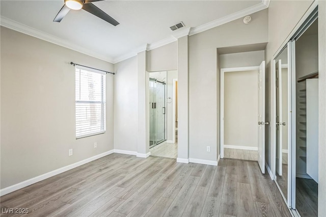 2229 Bowstring Dr, Las Vegas, NV 89142 - unfurnished bedroom featuring crown molding, wood finished floors, connected bathroom, a ceiling fan, and a closet