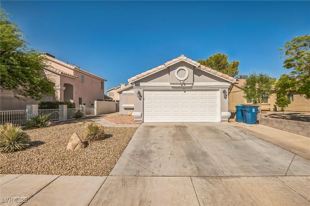 2229 Bowstring Dr, Las Vegas, NV 89142 - view of front of house with concrete driveway, stucco siding, an attached garage, and a tile roof