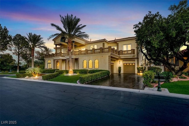 2200 Glenbrook Way, Las Vegas, NV 89117 - mediterranean / spanish house featuring a balcony, a garage, stucco siding, and asphalt driveway
