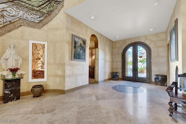 2200 Glenbrook Way, Las Vegas, NV 89117 - entrance foyer featuring arched walkways, french doors, and a towering ceiling