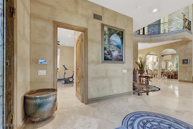 2200 Glenbrook Way, Las Vegas, NV 89117 - hall featuring arched walkways, a towering ceiling, and marble tiled flooring