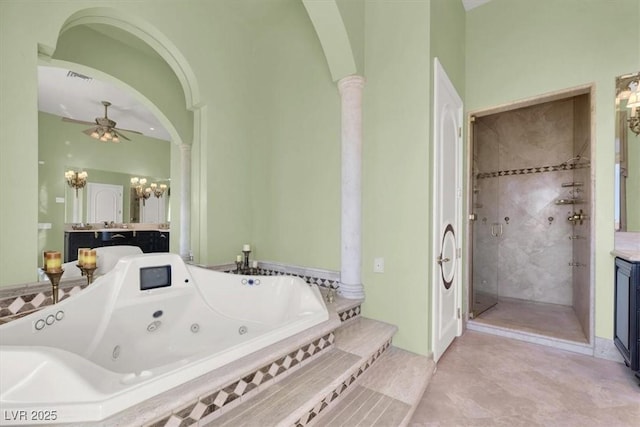 2200 Glenbrook Way, Las Vegas, NV 89117 - full bathroom with vanity, a whirlpool tub, ornate columns, a chandelier, and a stall shower