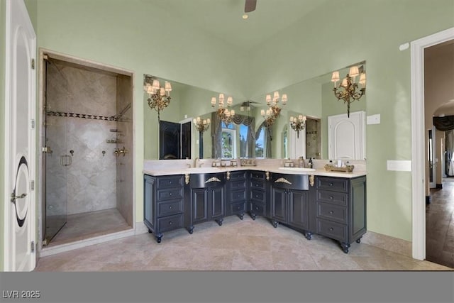 2200 Glenbrook Way, Las Vegas, NV 89117 - bathroom featuring a chandelier, double vanity, and a shower stall