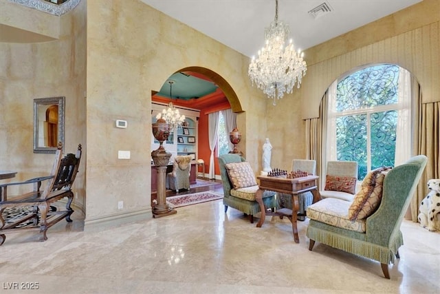 2200 Glenbrook Way, Las Vegas, NV 89117 - living area with a chandelier, arched walkways, and a high ceiling