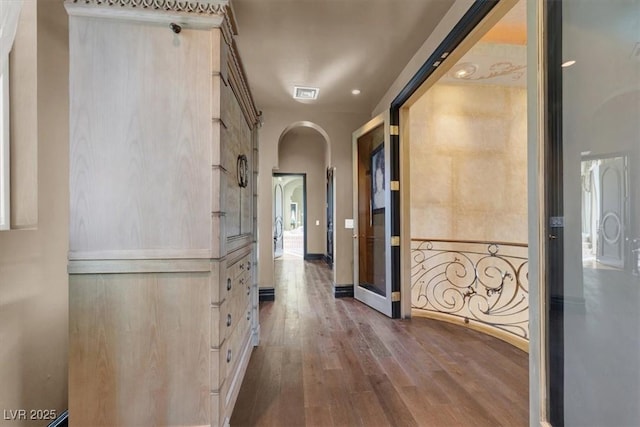2200 Glenbrook Way, Las Vegas, NV 89117 - hallway with arched walkways and dark wood-style floors