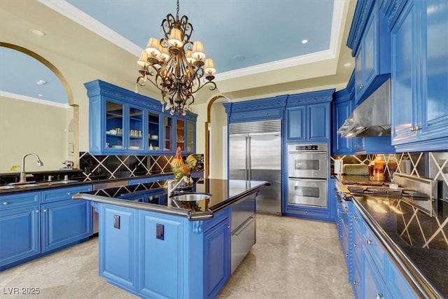 2200 Glenbrook Way, Las Vegas, NV 89117 - kitchen featuring stainless steel appliances, dark countertops, blue cabinets, tasteful backsplash, and ornamental molding