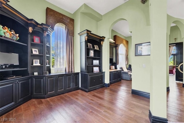 2200 Glenbrook Way, Las Vegas, NV 89117 - unfurnished office with wood finished floors, arched walkways, and a towering ceiling