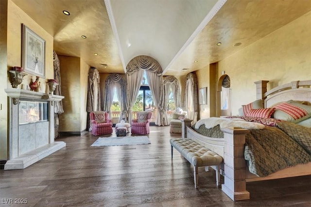 2200 Glenbrook Way, Las Vegas, NV 89117 - bedroom with lofted ceiling, access to outside, hardwood / wood-style floors, a premium fireplace, and recessed lighting