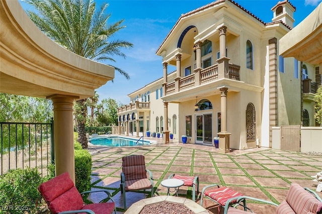 2200 Glenbrook Way, Las Vegas, NV 89117 - rear view of house featuring a balcony, stucco siding, and a patio