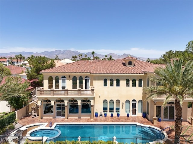 2200 Glenbrook Way, Las Vegas, NV 89117 - rear view of property with stucco siding, a balcony, a pool with connected hot tub, and a patio area