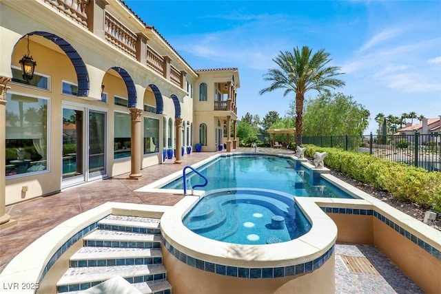 2200 Glenbrook Way, Las Vegas, NV 89117 - view of swimming pool featuring a pool with connected hot tub and a patio area