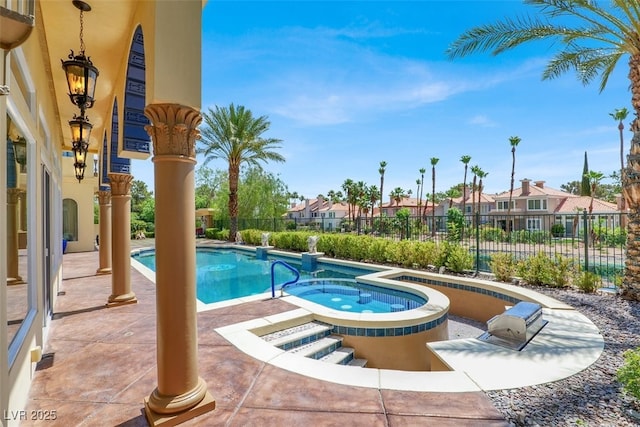 2200 Glenbrook Way, Las Vegas, NV 89117 - view of swimming pool with an in-ground hot tub, a patio area, and a residential view