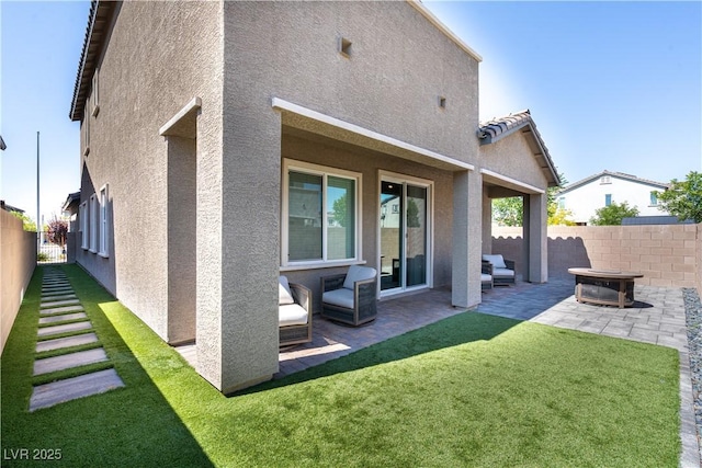 4376 Latitude Valley Ct, North Las Vegas, NV 89084 - back of property with stucco siding, a patio, and a fenced backyard