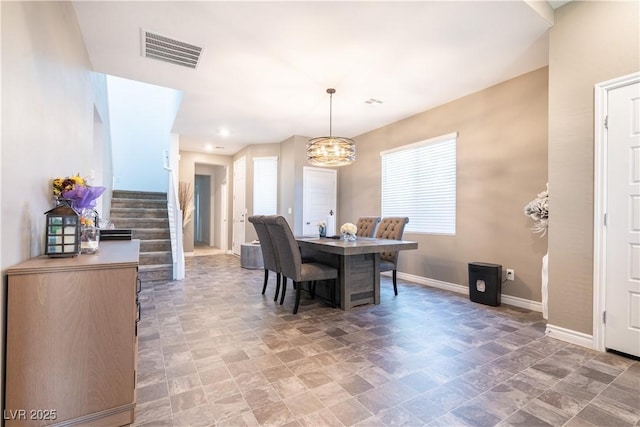 4376 Latitude Valley Ct, North Las Vegas, NV 89084 - dining area with stairway, stone finish flooring, and a chandelier