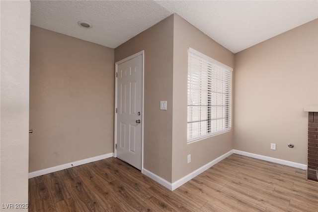 317 Brent Ct, Henderson, NV 89074 - foyer featuring wood finished floors and a textured ceiling