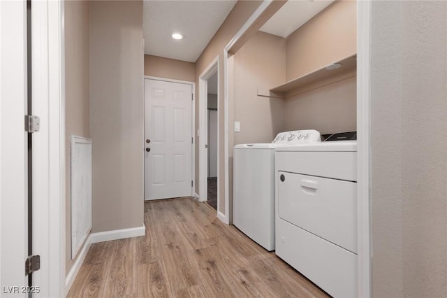 317 Brent Ct, Henderson, NV 89074 - laundry area with separate washer and dryer, light wood finished floors, and recessed lighting