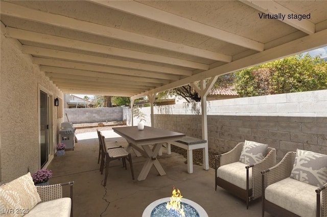 317 Brent Ct, Henderson, NV 89074 - fenced backyard featuring a patio area, a fire pit, outdoor dining space, and grilling area