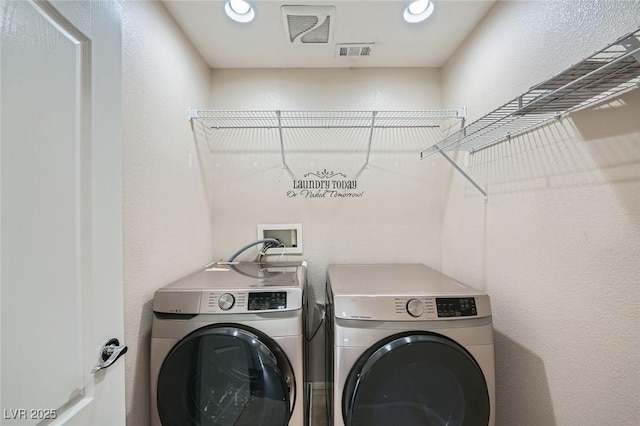 10428 Mulvaney Cir, Las Vegas, NV 89141 - laundry area with washer and clothes dryer and recessed lighting