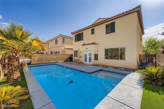 10428 Mulvaney Cir, Las Vegas, NV 89141 - view of swimming pool with french doors and a fenced backyard