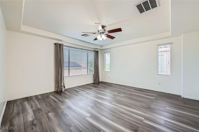 10428 Mulvaney Cir, Las Vegas, NV 89141 - empty room with a raised ceiling, ceiling fan, and wood finished floors