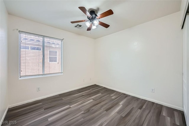 10428 Mulvaney Cir, Las Vegas, NV 89141 - empty room with dark wood-style floors and a ceiling fan