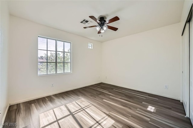 10428 Mulvaney Cir, Las Vegas, NV 89141 - spare room featuring a ceiling fan and dark wood-style flooring