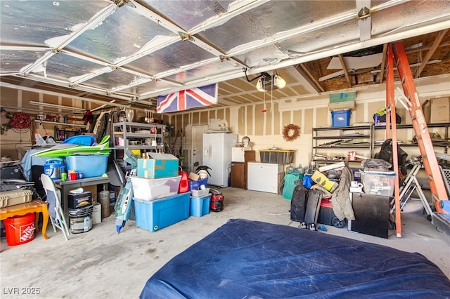5539 Foxtail Ridge St, North Las Vegas, NV 89031 - garage with a garage door opener and white refrigerator with ice dispenser
