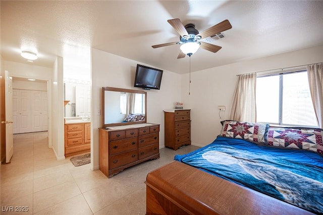 4616 E Idaho Ave, Las Vegas, NV 89104 - bedroom featuring light tile patterned floors, a ceiling fan, and ensuite bathroom