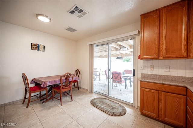 4616 E Idaho Ave, Las Vegas, NV 89104 - dining room featuring baseboards and light tile patterned floors