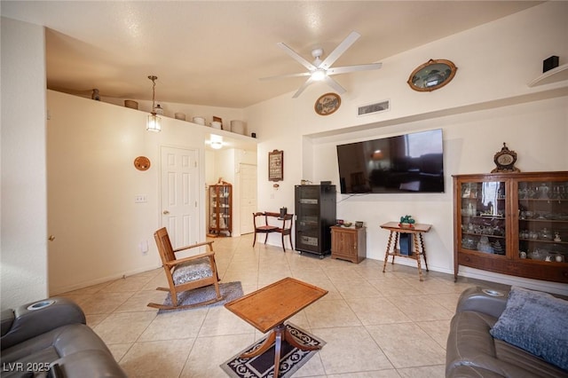 4616 E Idaho Ave, Las Vegas, NV 89104 - living room featuring light tile patterned floors, ceiling fan, and lofted ceiling