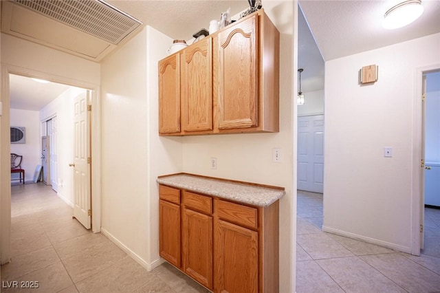 4616 E Idaho Ave, Las Vegas, NV 89104 - hallway featuring light tile patterned floors and baseboards