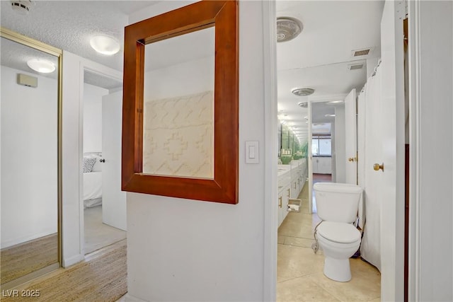 205 E Harmon Ave Unit 306, Las Vegas, NV 89169 - bathroom with vanity and tile patterned floors