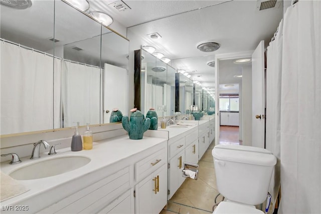 205 E Harmon Ave Unit 306, Las Vegas, NV 89169 - full bathroom featuring tile patterned floors, double vanity, and curtained shower