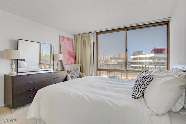 205 E Harmon Ave Unit 306, Las Vegas, NV 89169 - bedroom featuring light colored carpet and access to outside
