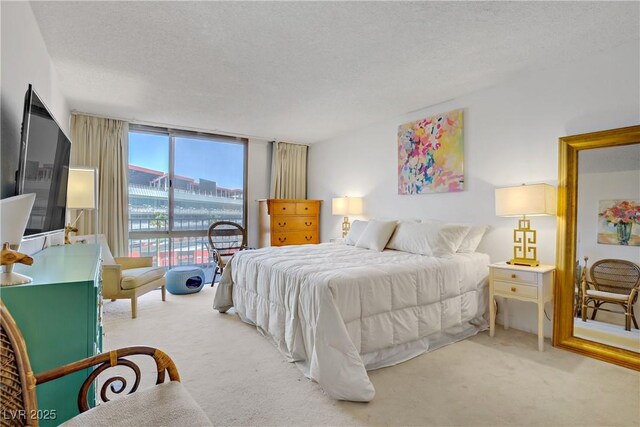 205 E Harmon Ave Unit 306, Las Vegas, NV 89169 - carpeted bedroom with a textured ceiling, access to outside, and floor to ceiling windows