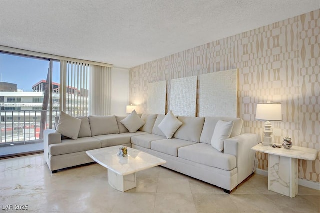 205 E Harmon Ave Unit 306, Las Vegas, NV 89169 - living room with wallpapered walls and a textured ceiling
