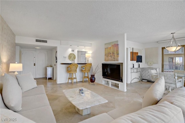 205 E Harmon Ave Unit 306, Las Vegas, NV 89169 - living area with a textured ceiling