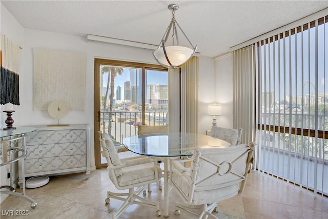 205 E Harmon Ave Unit 306, Las Vegas, NV 89169 - tiled dining room with a skyline view