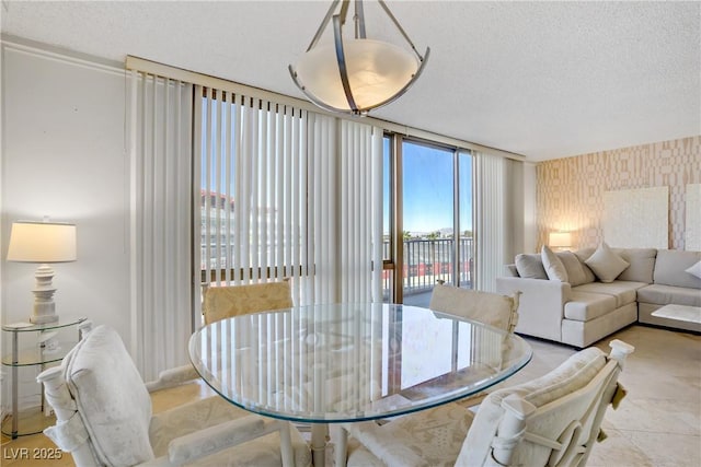 205 E Harmon Ave Unit 306, Las Vegas, NV 89169 - dining space featuring a textured ceiling