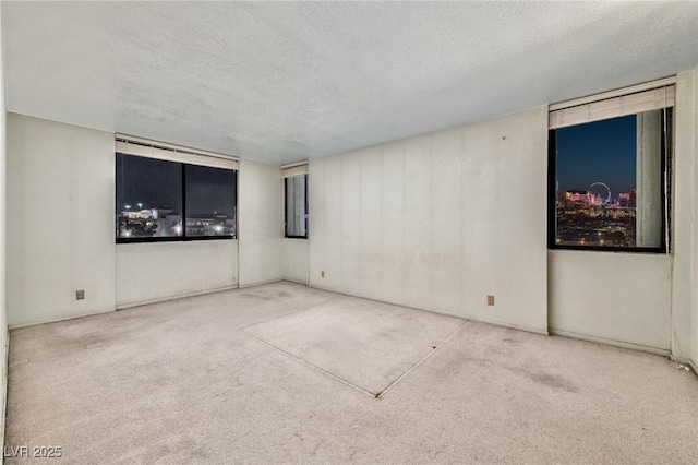 3930 University Center Dr Unit 412, Las Vegas, NV 89119 - carpeted empty room featuring a textured ceiling