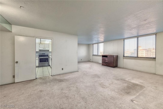 3930 University Center Dr Unit 412, Las Vegas, NV 89119 - empty room with light colored carpet and a textured ceiling