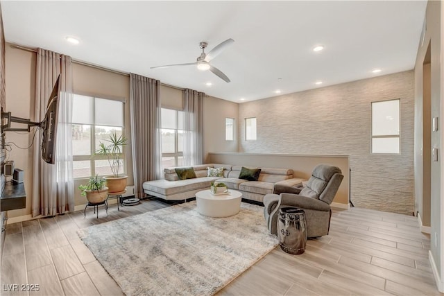 4336 Guava Ct Unit 0, Las Vegas, NV 89135 - living room with a ceiling fan, wood finish floors, an accent wall, and recessed lighting