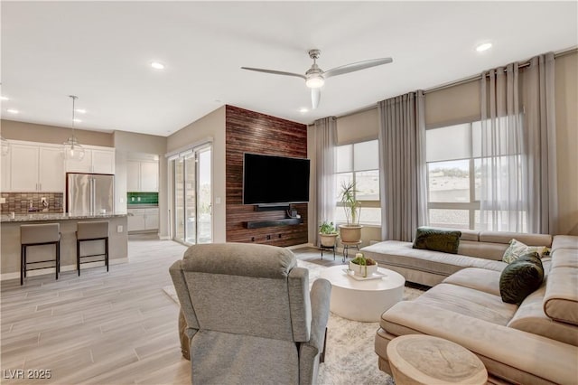 4336 Guava Ct, Las Vegas, NV 89135 - living room featuring a ceiling fan, recessed lighting, and light wood-type flooring