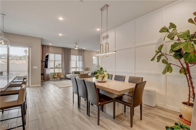 4336 Guava Ct Unit 0, Las Vegas, NV 89135 - dining room featuring a decorative wall, wood finish floors, and recessed lighting