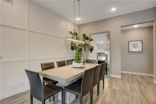 4336 Guava Ct Unit 0, Las Vegas, NV 89135 - dining space featuring wood finish floors, a decorative wall, and recessed lighting