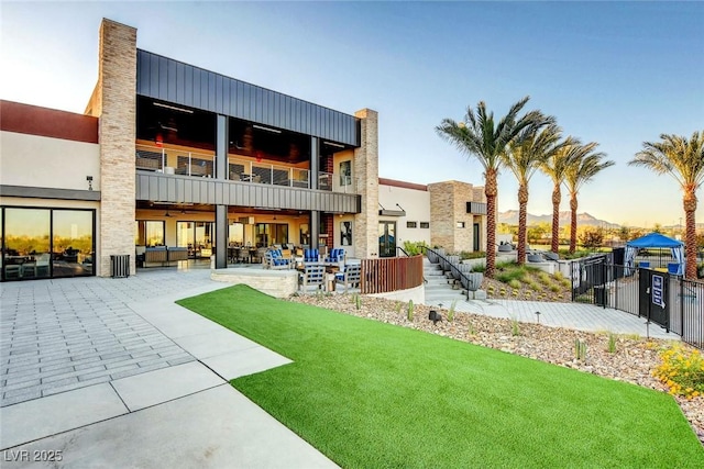 4336 Guava Ct Unit 0, Las Vegas, NV 89135 - rear view of house with a patio, a balcony, a mountain view, and outdoor lounge area